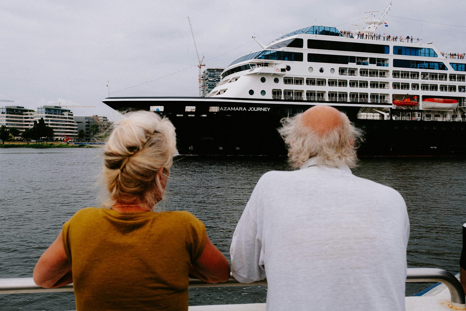 A couple looking at an Azamara Cruise Ship