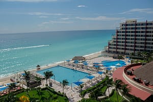 donato-gamboa-iydlrSG97QU-unsplash all-inclusive resort next to beach with turquoise ocean water