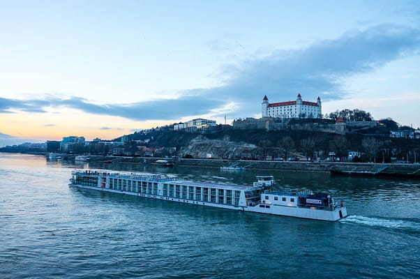 bratislava-4795799_1280 A river cruise ship sailing in Slovakia.