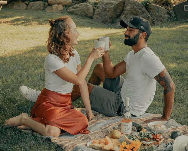 clay-banks-VsC9m6Tgx6o-unsplash couple enjoying a picnic