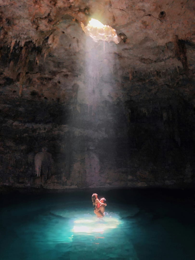 matej-rieciciar-3I1VmbiVR9M-unsplash-1 Couple swimming in a cenote